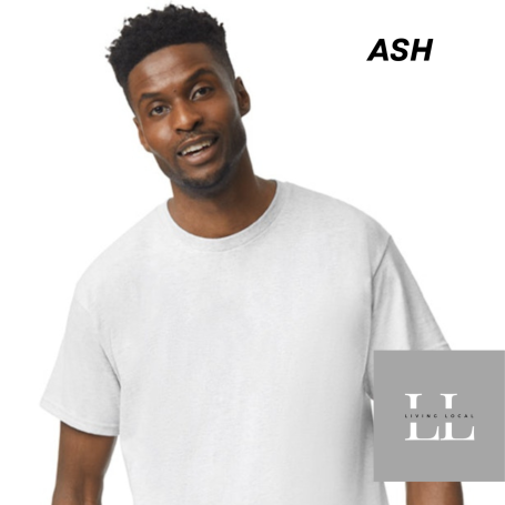 Smiling man wearing a plain gray t-shirt against a white background.